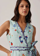 V-neck detail with folk embroidery, zig-zag rickrack and wrap closure