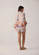 Back studio view with shell border print across the hem