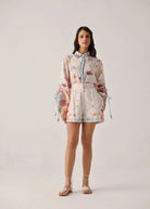 Full-length studio view paired with the seaborn shell-print shirt