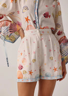 Front detail showing pleated front, button waist and pocket placement