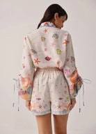 Back view with elasticated waist and pale blue contrast hem trim