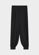 Flat front view of the pleats, belt loops and button-fastened ankle cuffs