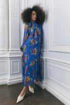 Three-quarter view, fluid chiffon drape and tiered hem panel
