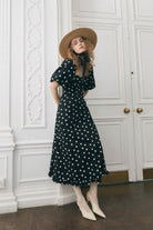 Side styling shot with straw boater and ribbon tie at the throat