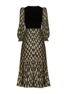 Back view, zip fastening at the neck, velvet yoke and gathered tiered hem