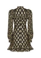 Back view, centre-back zip at the high neck, ruffled yoke and frilled hem