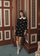 Frilled cuff and Peter Pan collar detail, worn with cream lace knee socks and bow-trimmed pointed flats