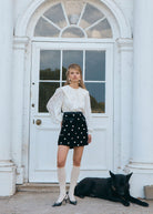 Lower angle at the doorway, floral jacquard weave and cuffed balloon sleeves
