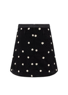 Back view, centre back zip and flower beading across the A-line hem