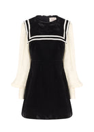 Front on white, double striped sailor collar, fitted bodice and cream cuffed sleeves