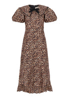 Front view, gathered puff sleeves, collar bow and narrow ruffle at the hem