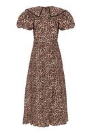 Back view, wide piped collar, centre-back zip and fitted waist seam