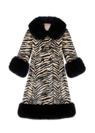Front on white, double-breasted buttons, wide faux fur collar and deep cuffs