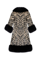 Back view, chevron stripe match down the centre back and faux fur trimmed hem