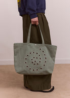 Damson Madder Raine swirly eyelet tote in mint, medium canvas with eyelet trim
