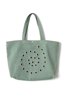 Front view, Raine tote with all-over swirly eyelet detail