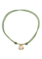 By Alona Sabine necklace, green silk cord with a gold-plated oval CZ pendant