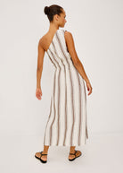 Back view, bare shoulder and shirred waist with floor-skimming midi skirt