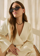 Worn with a cream blazer, leather cord choker and sunglasses