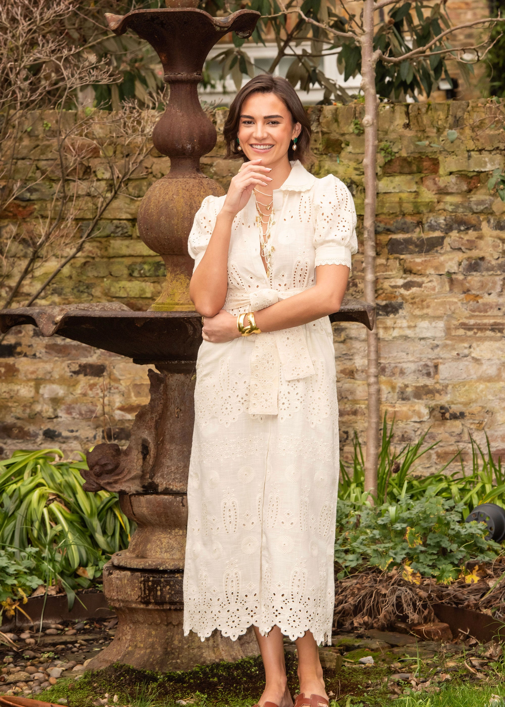 New Day Originals Smiling garden portrait beside the cast-iron fountain