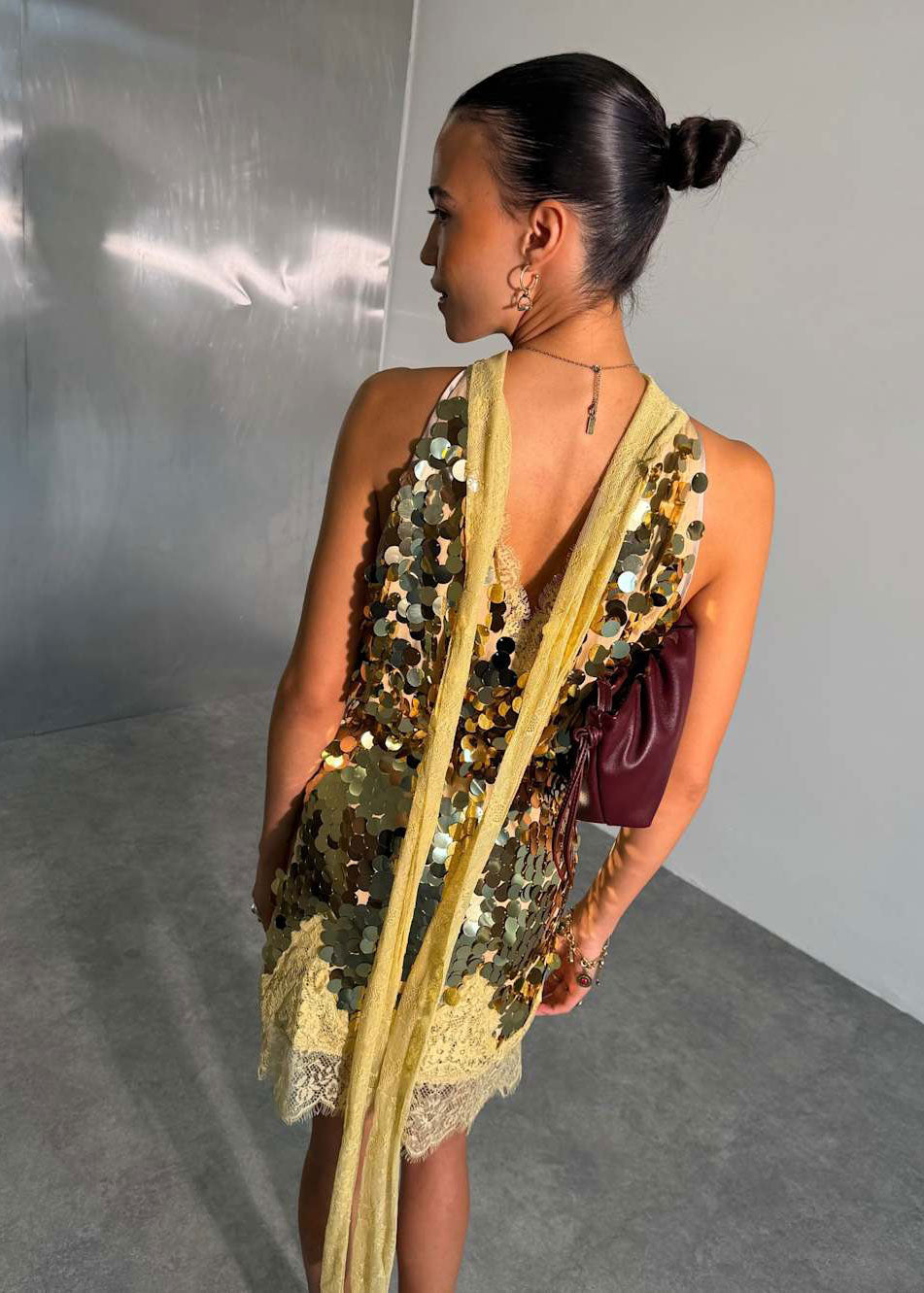 Never Fully Dressed Back view with long yellow scarf ties trailing down the back
