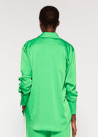 Back view, longer curved back hem on crinkled green satin