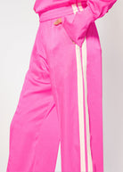 Close-up of the elasticated waistband, slash pocket and side stripe detail