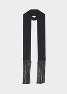 Flat view of the narrow scarf with loose fringe at both ends