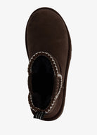 Top-down view of the stitched opening with soft black lining and branded heel tab