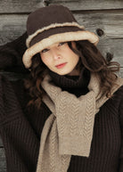 Reverse side, plush caramel shearling with panelled seams and small leather tab