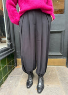 Ottod'Ame black trousers, deep front pleats with a softly tapered elasticated cuff