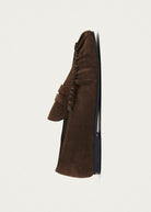 Top-down view of the moccasin upper and fringe detail