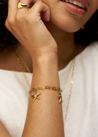Close-up of the three smooth starfish charms hanging from the chain