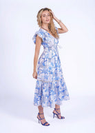 Back view, ruffled flutter sleeves and tiered skirt with crochet inset