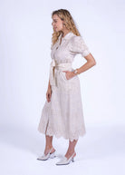 Side three-quarter view, button-through placket and scalloped eyelet hem