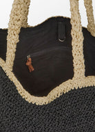 Open top view showing the black canvas lining and inner zip pocket