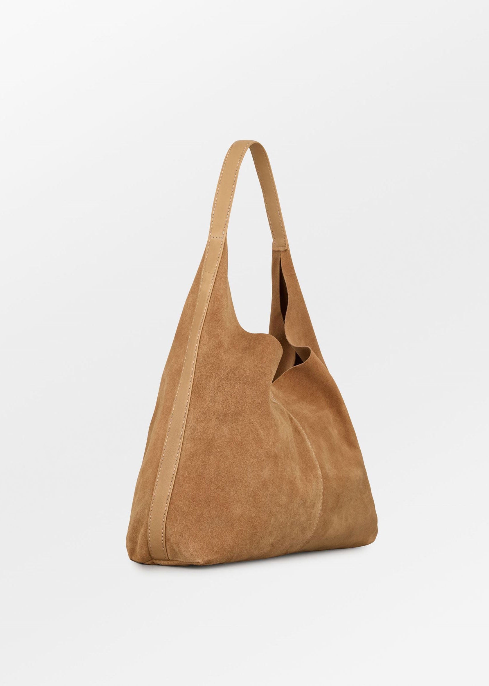 BeckSöndergaard Three-quarter angle, leather strap meeting the soft suede body