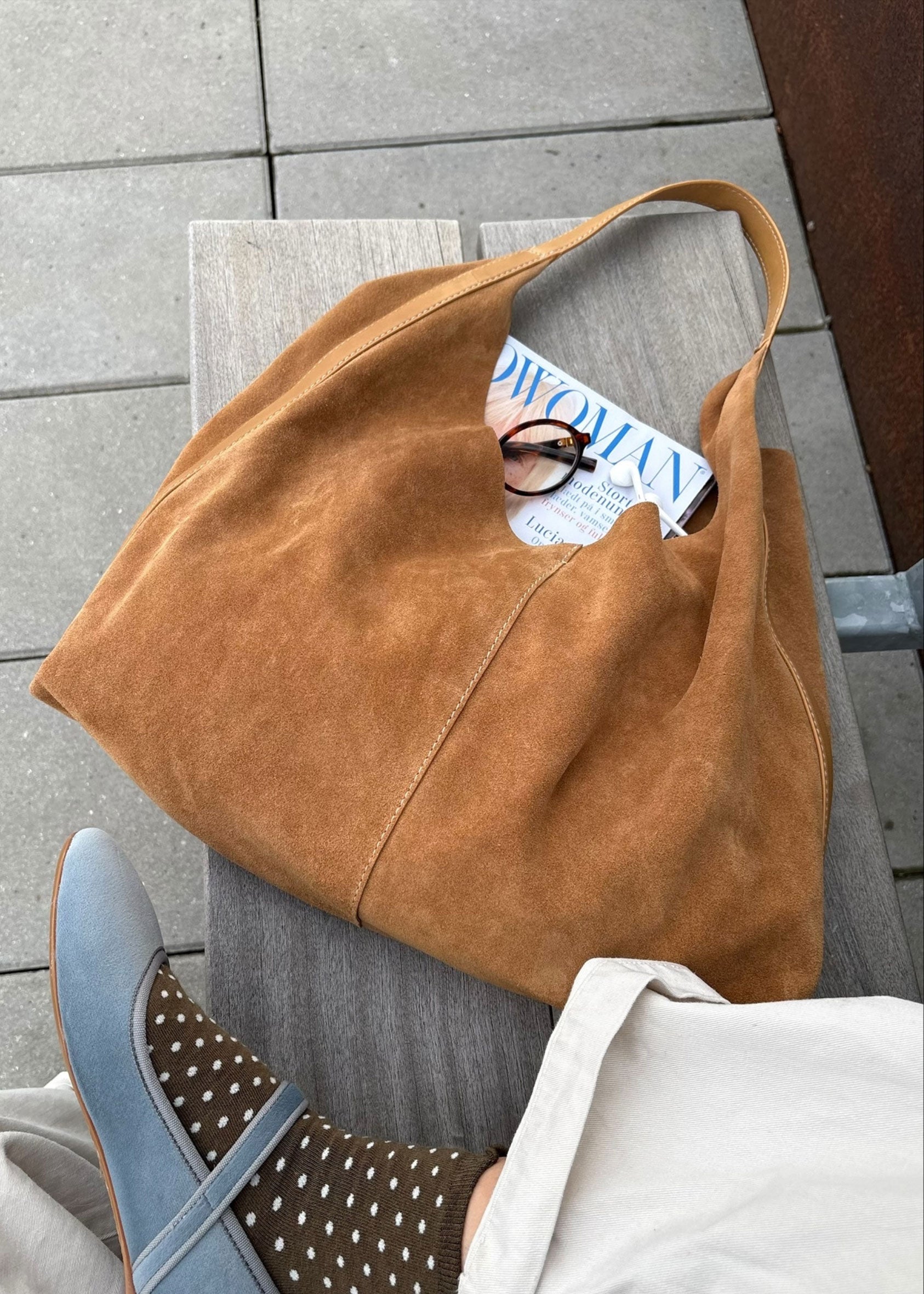 BeckSöndergaard Placed on a bench with a magazine peeking from the top