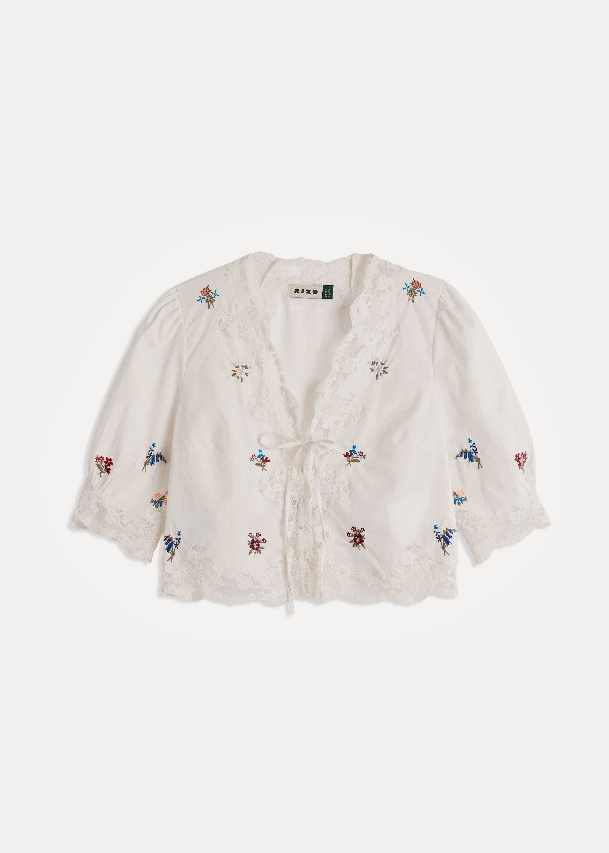 Rixo Flat-lay of the cropped top showing the full embroidered bouquet pattern
