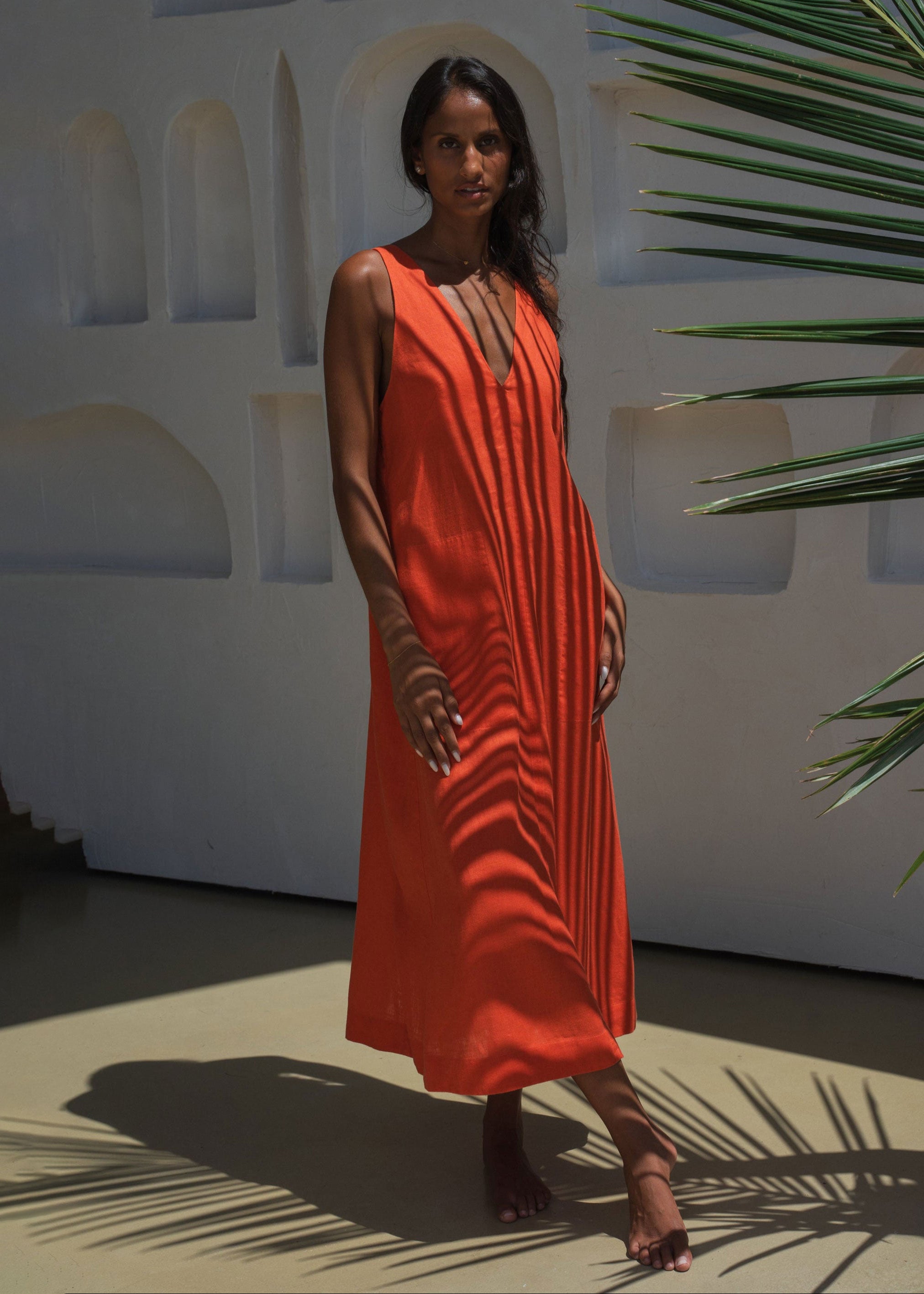 Lilly Pilly Full length in dappled palm light, sleeveless midi silhouette