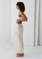 Side profile showing the cropped wide-leg silhouette