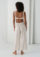 Back view, twin patch pockets on the gathered waistband