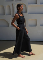 Side profile in motion, fluid wide-leg drape and side pockets