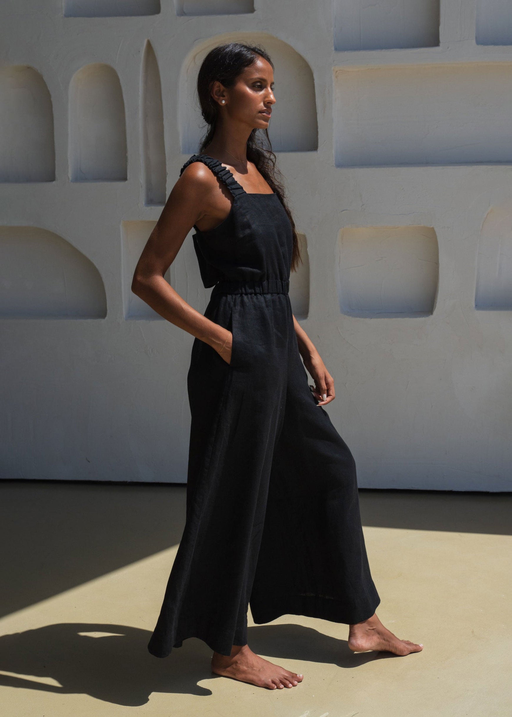 Lilly Pilly Side profile in motion, fluid wide-leg drape and side pockets