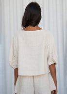 Back view, dropped shoulder seam and gathered cuff