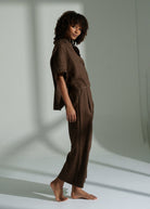 Three-quarter side view of the linen co-ord in soft daylight