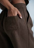 Pocket detail with hand inserted, showing the linen weave up close