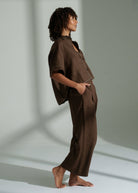Side profile, full length linen drape over bare feet