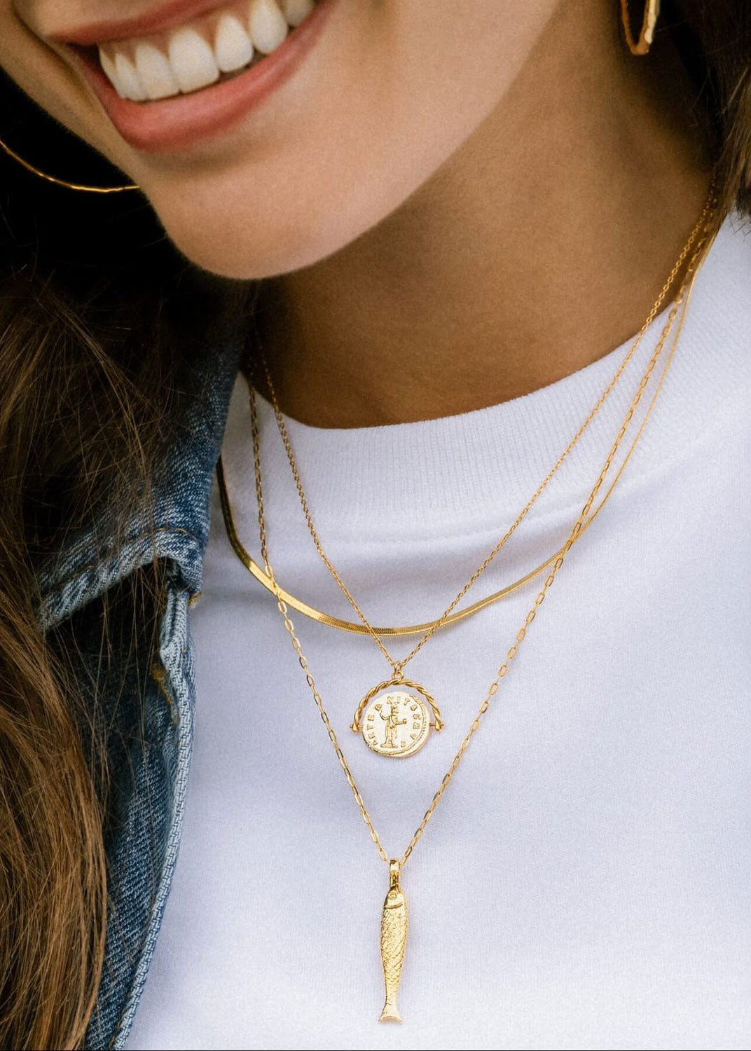 Orelia On-neck styling shot with the fish pendant at chest level