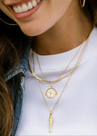 On-neck styling shot with the fish pendant at chest level